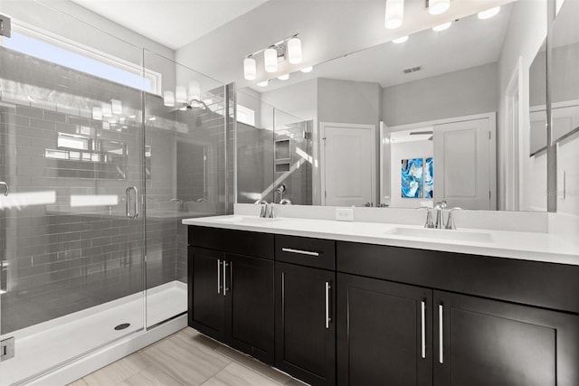 2163 White Feather Loop, Oakland, FL 34787 - full bathroom featuring double vanity and a shower stall
