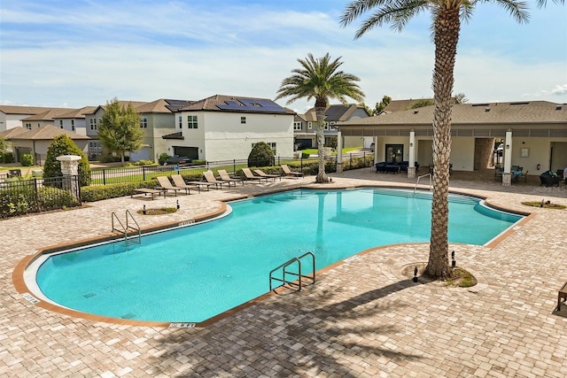 2163 White Feather Loop, Oakland, FL 34787 - community pool with a patio and a residential view