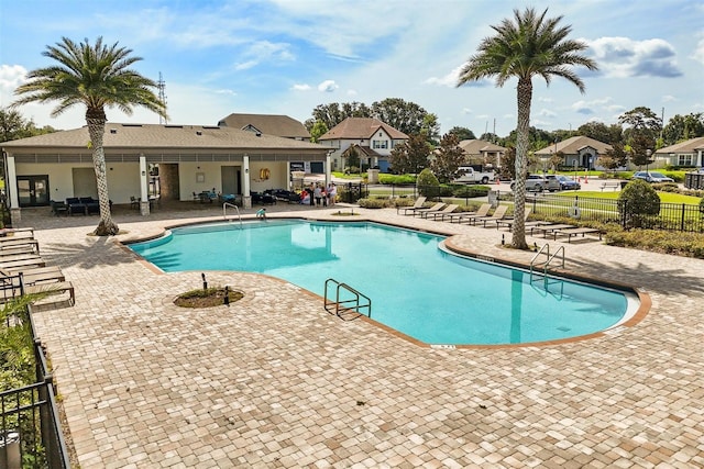 2163 White Feather Loop, Oakland, FL 34787 - community pool featuring a patio area and a residential view