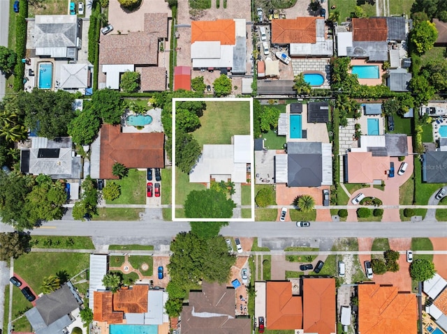 138 W 52nd St, Hialeah, FL 33012 - aerial view of property and surrounding area featuring property parcel outlined and nearby suburban area