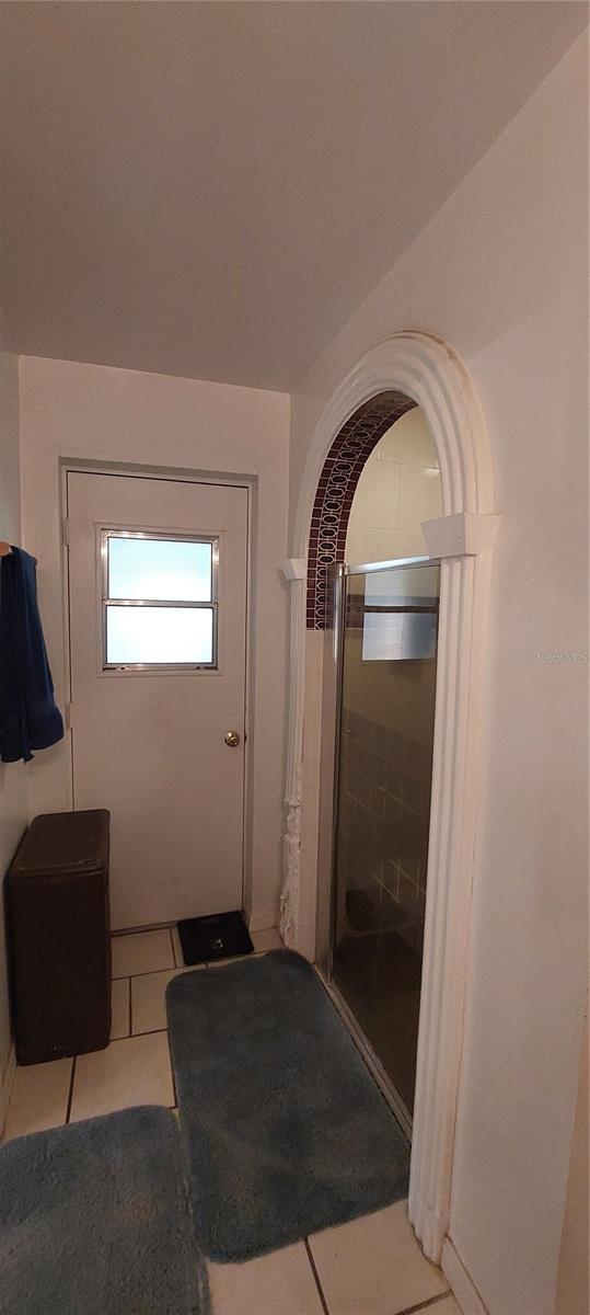 13420 Debbie Ln, Clermont, FL 34715 - corridor featuring light tile patterned flooring
