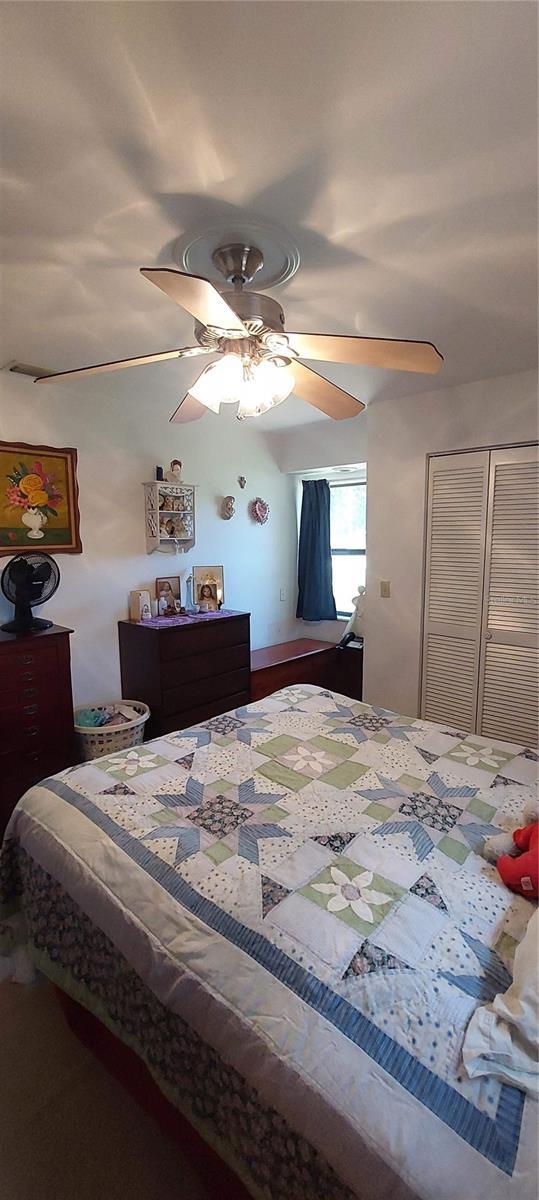 13420 Debbie Ln, Clermont, FL 34715 - bedroom featuring ceiling fan