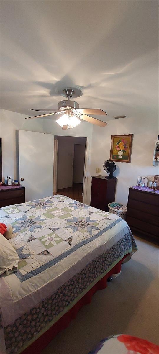 13420 Debbie Ln, Clermont, FL 34715 - bedroom featuring ceiling fan and carpet flooring