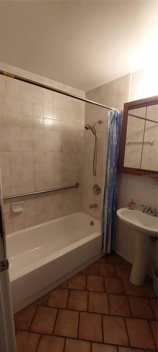 13420 Debbie Ln, Clermont, FL 34715 - full bathroom with shower / bath combo and tile patterned floors