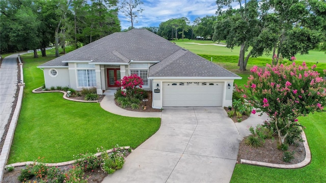 5349 Grove Mnr, Lady Lake, FL 32159 - single story home with stucco siding, an attached garage, roof with shingles, and a front lawn