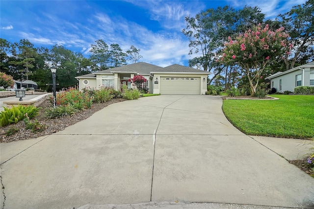 5349 Grove Mnr, Lady Lake, FL 32159 - ranch-style home with driveway, a front yard, a garage, and stucco siding