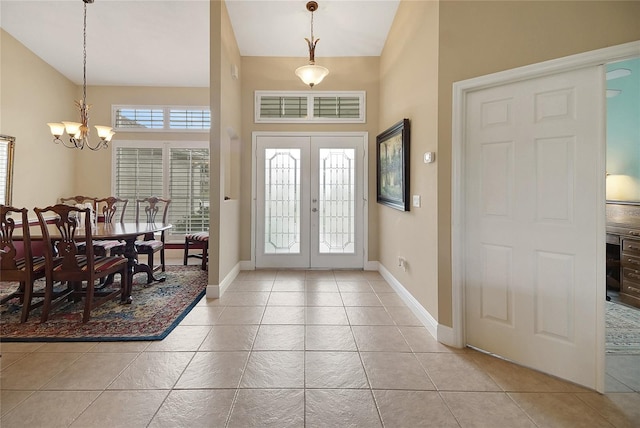 5349 Grove Mnr, Lady Lake, FL 32159 - entrance foyer with a chandelier, light tile patterned floors, lofted ceiling, and french doors