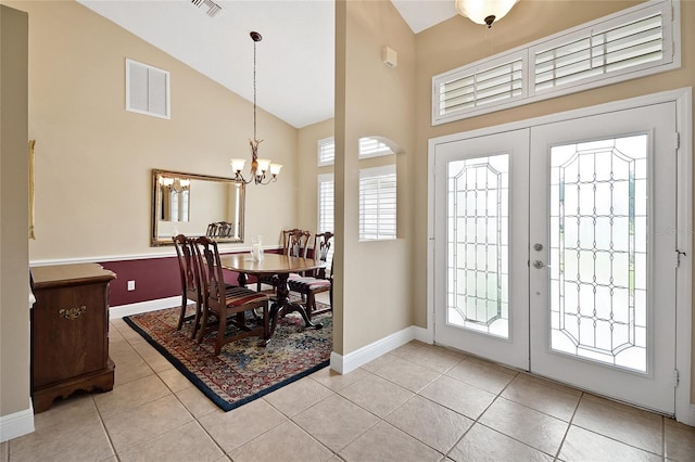 5349 Grove Mnr, Lady Lake, FL 32159 - foyer entrance featuring high vaulted ceiling, light tile patterned floors, a chandelier, and french doors