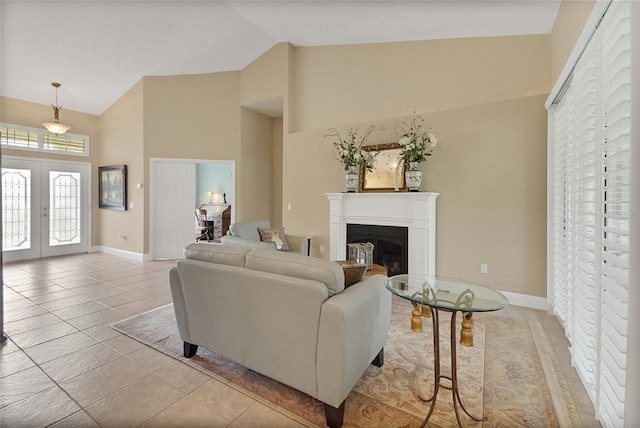 5349 Grove Mnr, Lady Lake, FL 32159 - tiled living room featuring high vaulted ceiling, french doors, and a fireplace