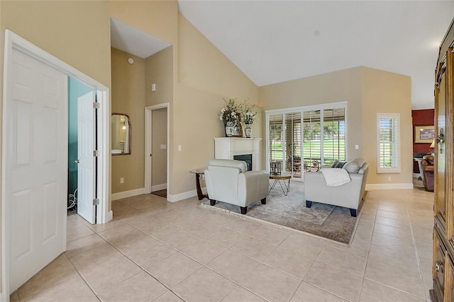 5349 Grove Mnr, Lady Lake, FL 32159 - living room with light tile patterned floors, high vaulted ceiling, and a fireplace
