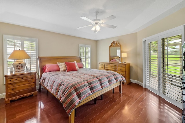 5349 Grove Mnr, Lady Lake, FL 32159 - bedroom with multiple windows, wood finished floors, a ceiling fan, and access to exterior