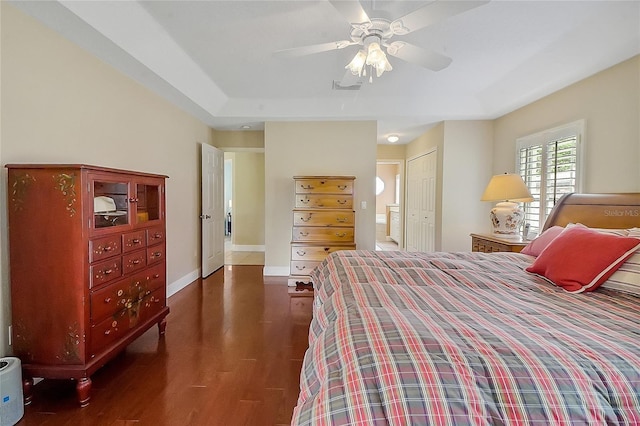 5349 Grove Mnr, Lady Lake, FL 32159 - bedroom featuring dark wood-type flooring, ensuite bathroom, a ceiling fan, and a closet