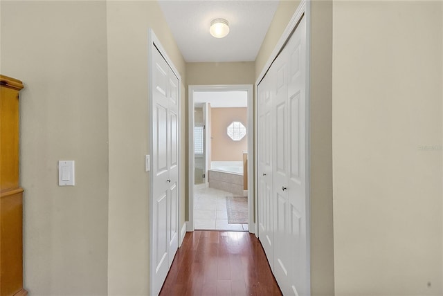 5349 Grove Mnr, Lady Lake, FL 32159 - hall featuring dark wood-style flooring and baseboards