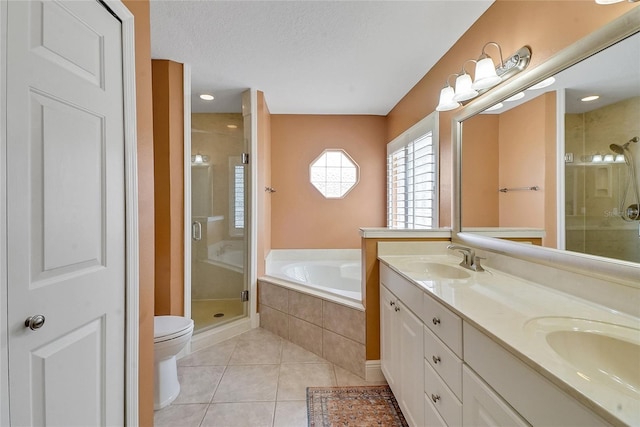 5349 Grove Mnr, Lady Lake, FL 32159 - bathroom with a shower stall, a bath, double vanity, tile patterned flooring, and a textured ceiling