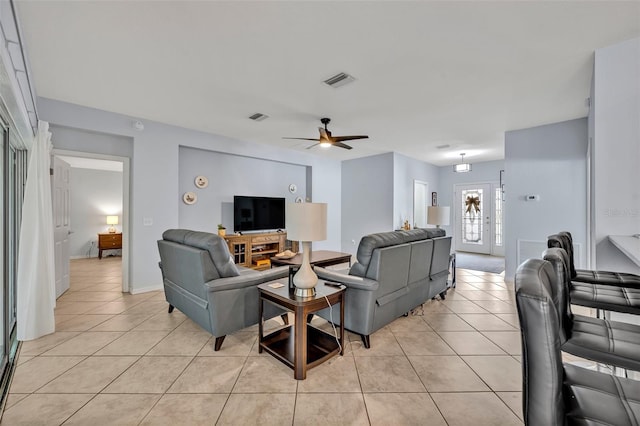 11816 SE 91st Cir, Summerfield, FL 34491 - living room with light tile patterned floors and a ceiling fan
