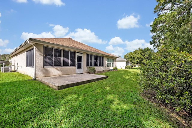 11816 SE 91st Cir, Summerfield, FL 34491 - rear view of house with a patio area, a yard, and stucco siding