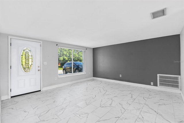 11326 Yellowwood Ln, Port Richey, FL 34668 - foyer entrance featuring light marble finish floors and baseboards