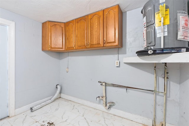11326 Yellowwood Ln, Port Richey, FL 34668 - washroom featuring cabinet space, electric water heater, gas dryer hookup, marble finish flooring, and washer hookup