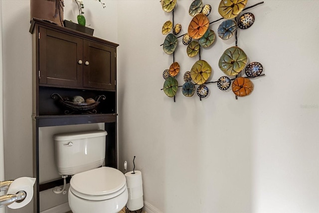 30300 Hackney Loop, Mount Dora, FL 32757 - half bathroom featuring toilet and baseboards