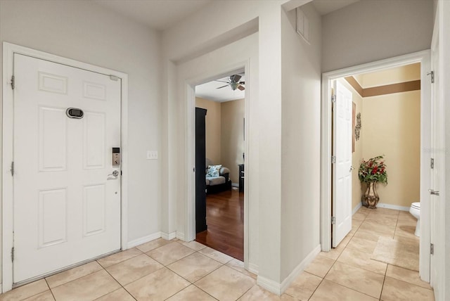 30300 Hackney Loop, Mount Dora, FL 32757 - entryway featuring light tile patterned flooring and a ceiling fan