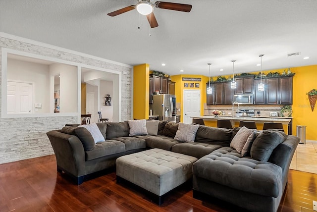 30300 Hackney Loop, Mount Dora, FL 32757 - living room featuring a ceiling fan, dark wood-type flooring, and recessed lighting