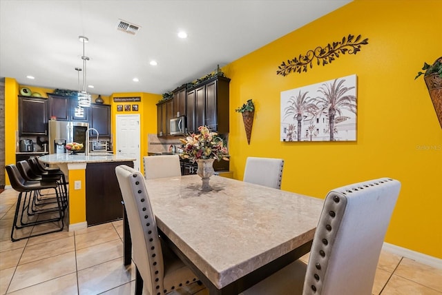 30300 Hackney Loop, Mount Dora, FL 32757 - dining space featuring light tile patterned floors and recessed lighting