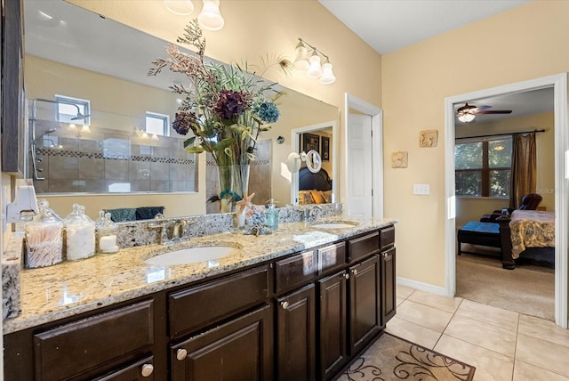 30300 Hackney Loop, Mount Dora, FL 32757 - ensuite bathroom featuring double vanity, tile patterned floors, a walk in shower, and ceiling fan