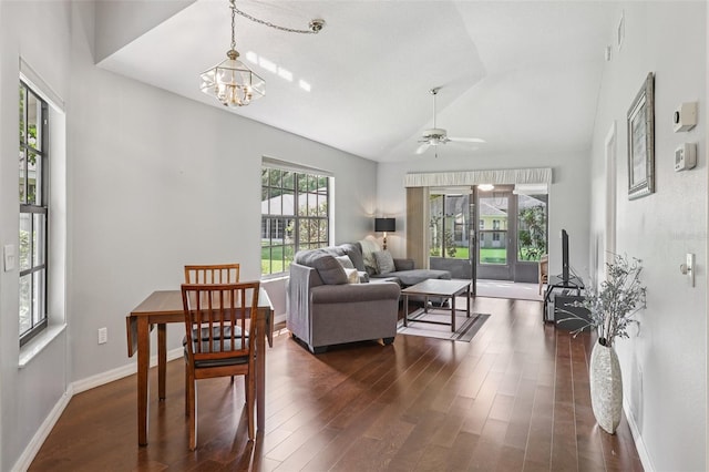 324 Juniper Way, Tavares, FL 32778 - living room with vaulted ceiling, dark wood-type flooring, ceiling fan, and a chandelier