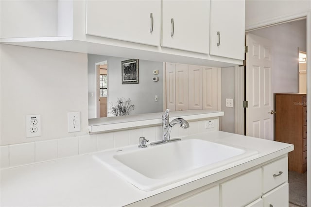 324 Juniper Way, Tavares, FL 32778 - kitchen featuring white cabinetry and light countertops