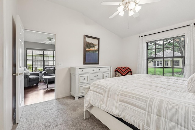 324 Juniper Way, Tavares, FL 32778 - bedroom with vaulted ceiling, multiple windows, light carpet, and ceiling fan