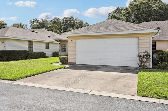 324 Juniper Way, Tavares, FL 32778 - single story home featuring concrete driveway, a front lawn, and roof with shingles
