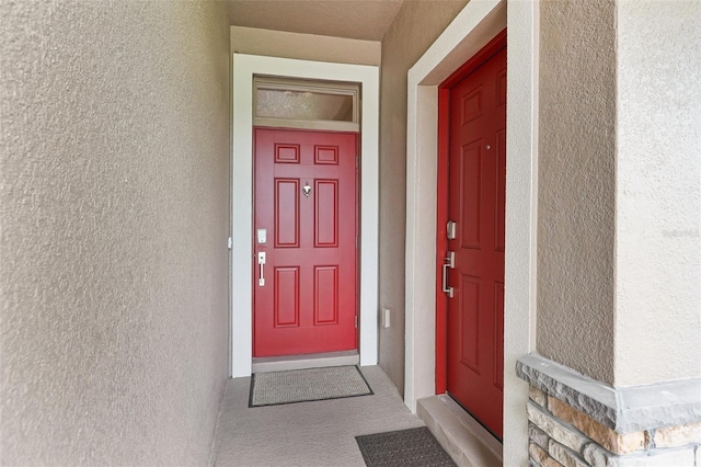 49 White Horse Way, Groveland, FL 34736 - doorway to property with stucco siding