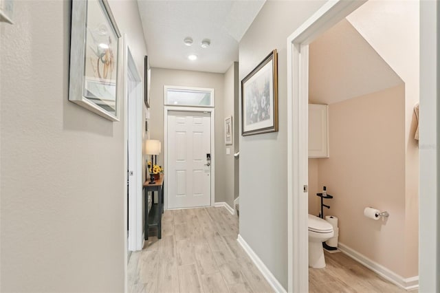 49 White Horse Way, Groveland, FL 34736 - corridor with light wood-type flooring and baseboards