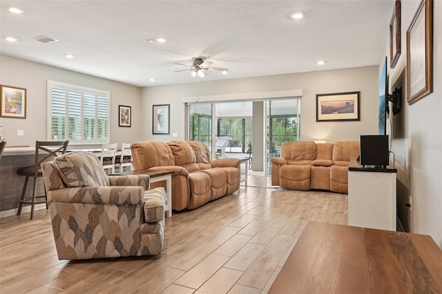 49 White Horse Way, Groveland, FL 34736 - living area with light wood finished floors, a ceiling fan, plenty of natural light, and recessed lighting
