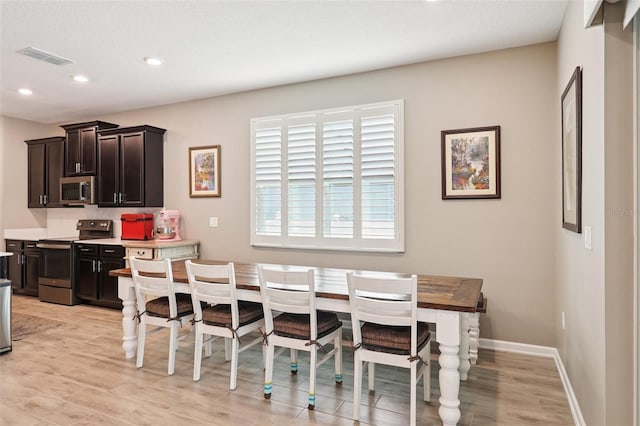 49 White Horse Way, Groveland, FL 34736 - dining room with light wood-type flooring and recessed lighting