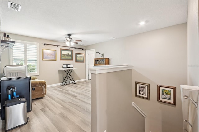 49 White Horse Way, Groveland, FL 34736 - hall featuring light wood finished floors and an upstairs landing