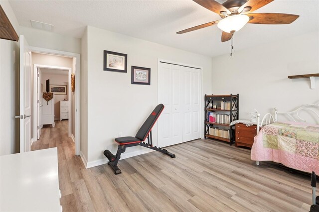 49 White Horse Way, Groveland, FL 34736 - bedroom featuring light wood-style floors, a closet, and ceiling fan