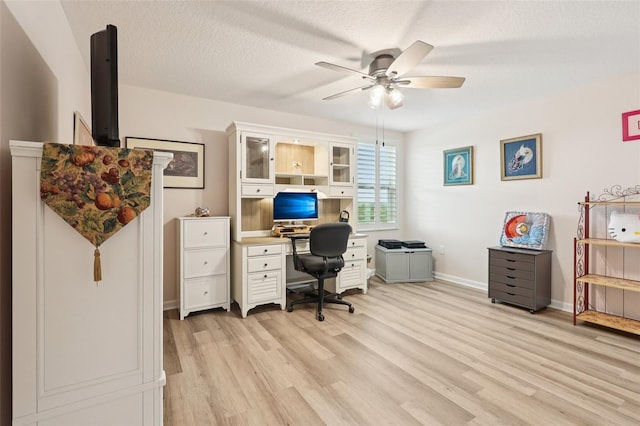 49 White Horse Way, Groveland, FL 34736 - home office featuring ceiling fan, light wood-type flooring, and a textured ceiling