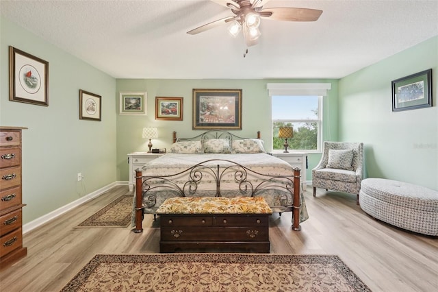 49 White Horse Way, Groveland, FL 34736 - bedroom featuring wood finished floors, ceiling fan, and a textured ceiling
