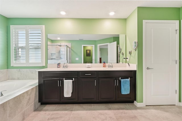 49 White Horse Way, Groveland, FL 34736 - full bathroom featuring a bath, double vanity, a shower stall, and tile patterned flooring
