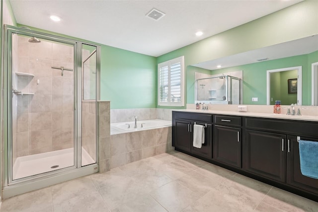 49 White Horse Way, Groveland, FL 34736 - full bathroom with double vanity, a shower stall, a bath, tile patterned floors, and recessed lighting