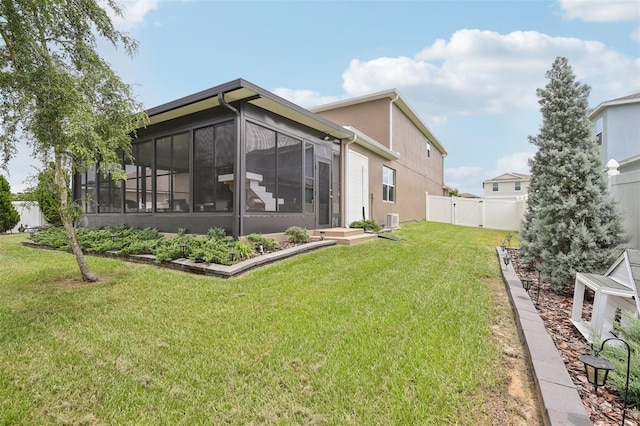 49 White Horse Way, Groveland, FL 34736 - rear view of property featuring a sunroom and stucco siding