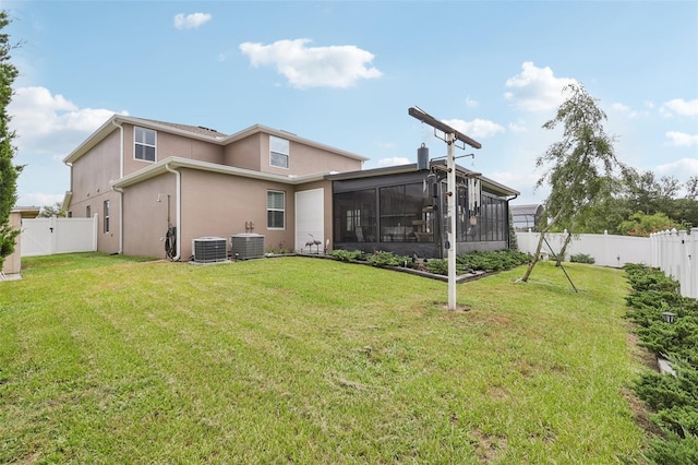 49 White Horse Way, Groveland, FL 34736 - back of property featuring a sunroom, stucco siding, a fenced backyard, and a gate