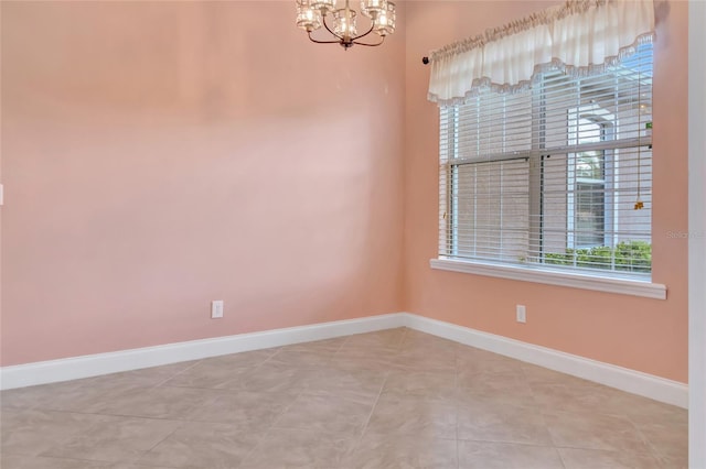 18139 Great Blue Heron Dr, Groveland, FL 34736 - unfurnished room with a chandelier and baseboards