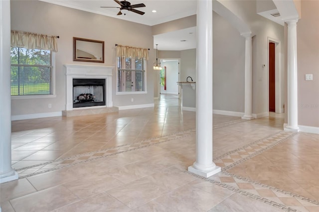 18139 Great Blue Heron Dr, Groveland, FL 34736 - unfurnished living room featuring light tile patterned floors, a ceiling fan, decorative columns, a fireplace with raised hearth, and inlaid floor details
