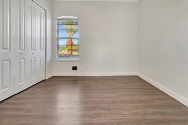 18139 Great Blue Heron Dr, Groveland, FL 34736 - unfurnished bedroom featuring wood finished floors and a closet