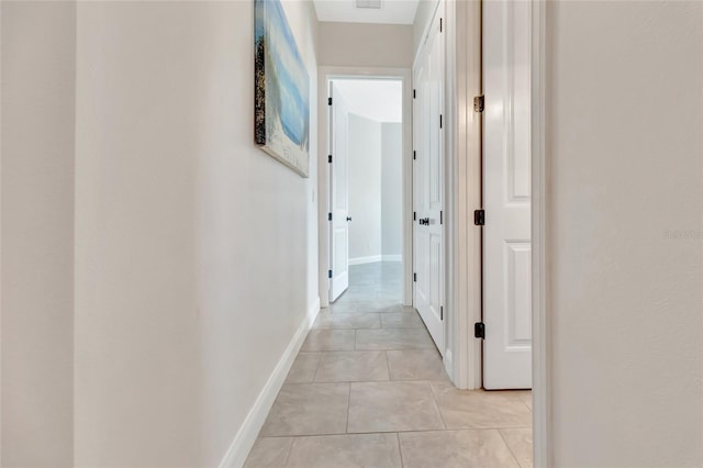 18139 Great Blue Heron Dr, Groveland, FL 34736 - hallway with light tile patterned floors and baseboards