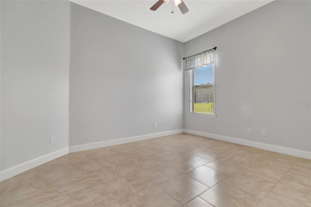 18139 Great Blue Heron Dr, Groveland, FL 34736 - empty room with a ceiling fan and light tile patterned floors