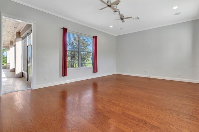 18139 Great Blue Heron Dr, Groveland, FL 34736 - spare room with plenty of natural light, a ceiling fan, wood finished floors, ornamental molding, and recessed lighting