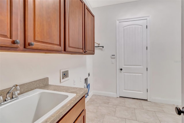 18139 Great Blue Heron Dr, Groveland, FL 34736 - laundry area featuring washer hookup, cabinet space, electric dryer hookup, and light tile patterned floors